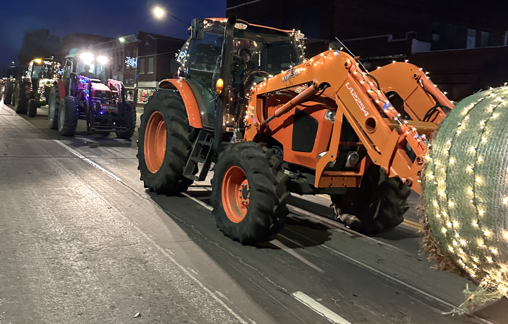 Brookfield FFA members and their tractors line the streets of Brookfield, Mo., during an annual Christmas parade.